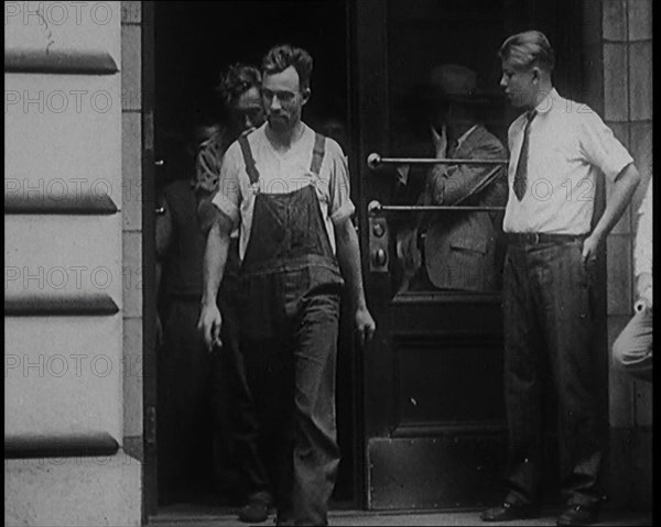 Alcohol Smugglers Coming Out of Court, 1929. Creator: British Pathe Ltd.