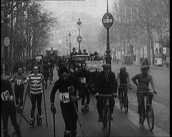 Racers Skiing Through Paris, France on Wheeled Skis, 1929. Creator: British Pathe Ltd.