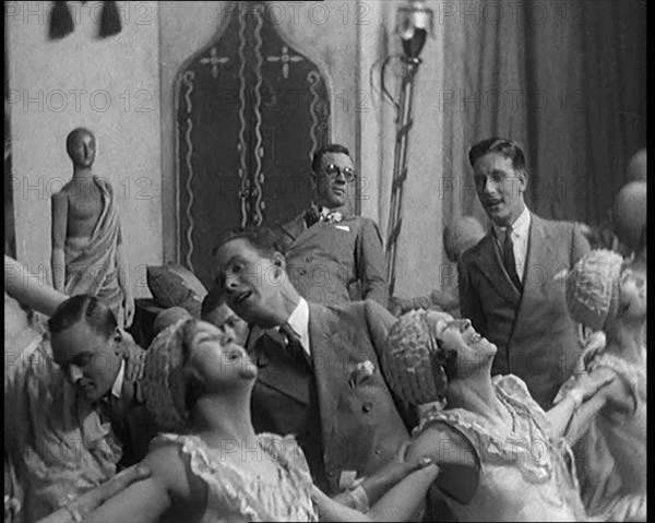 Scene from a Stage Show: Male and Female Civilians Dancing on a Stage in a Routine with..., 1929. Creator: British Pathe Ltd.