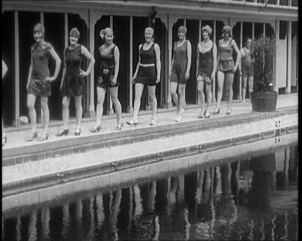 A Group of Young Female Civilians Wearing Short Swimsuits and Heeled Shoes Emerging from..., 1920. Creator: British Pathe Ltd.