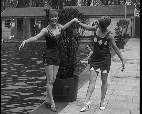 Two Young Female Civilians Wearing Short Swimsuits and Heeled Shoes Posing for the Camera..., 1920. Creator: British Pathe Ltd.