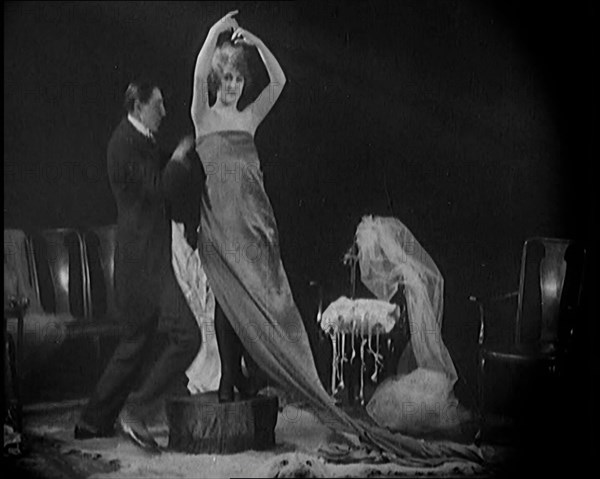 Alphonse Berge, Famous Fashion Designer,  Constructing a Dress, a Female Civilian Model..., 1920. Creator: British Pathe Ltd.