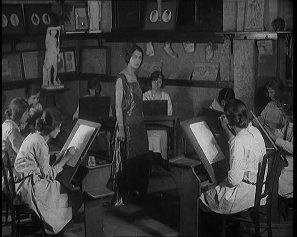 Young Female Civilian Wearing a Long Dress Posing for an All Female Arts Class, 1920. Creator: British Pathe Ltd.