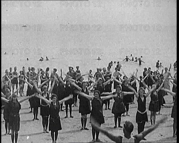 A Group of Female Civilians Exercising on a Beach, 1920. Creator: British Pathe Ltd.