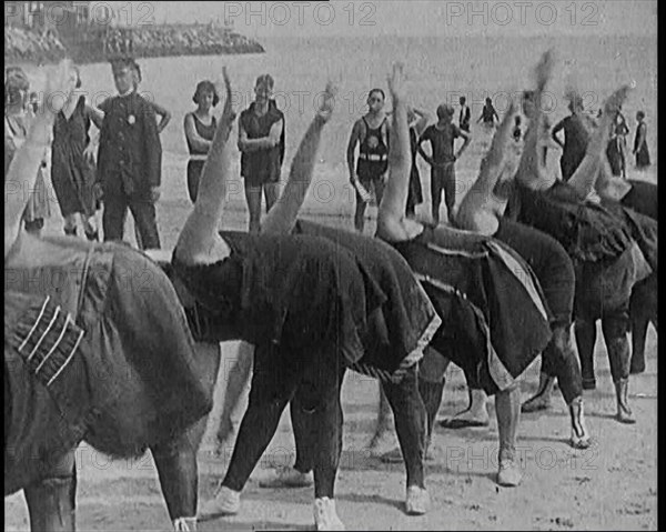 A Group of Plus Size Female Civilians Exercising on a Beach, 1920. Creator: British Pathe Ltd.