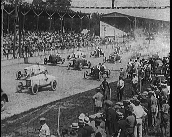 Racing Cars at the Start of a Race in Front of a Large Crowd, 1920. Creator: British Pathe Ltd.