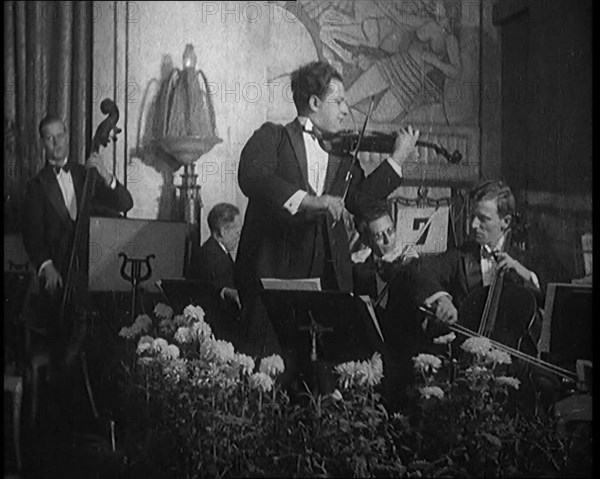 British Celebrated Violinist Albert Sandler, Born Abraham Sandler, Playing the Violin with..., 1920. Creator: British Pathe Ltd.