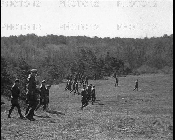 American Police Officers Searching the Area Outside American Aviator Charles Augustus..., 1930s. Creator: British Pathe Ltd.