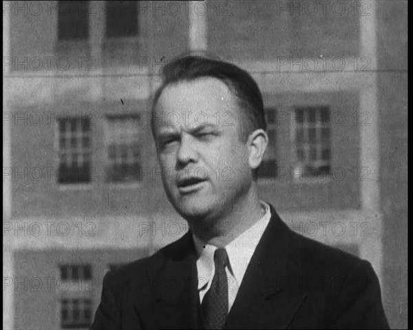 Male American Officer Giving an Official Statement Outside a Prison During the Investigation...,1930 Creator: British Pathe Ltd.