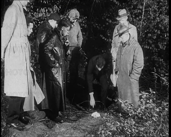 American Police Officers Searching the Area Outside American Aviator Charles Augustus..., 1930s. Creator: British Pathe Ltd.