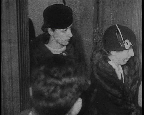 Bessie Mowat Goway AKA Betty Gow, Nurse of the Lindbergh Family Entering a Courtroom, 1930s. Creator: British Pathe Ltd.