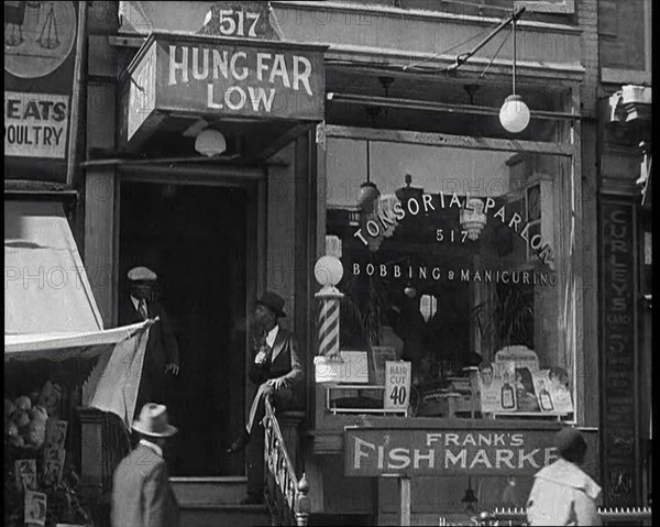 American Civilians Outside a Bobbing and Manicure Parlour, 1930s. Creator: British Pathe Ltd.