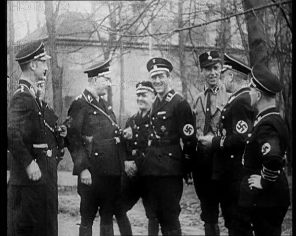 Uniformed Nazis Talking to Each Other, 1933. Creator: British Pathe Ltd.