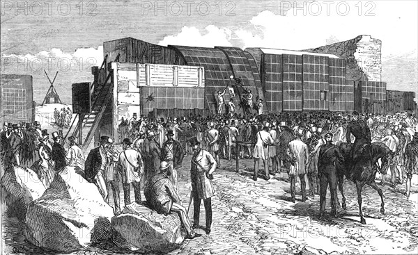 Experiments at Shoeburyness,...Plymouth Breakwater Target: examining the target after firing, 1868. Creator: C. R..