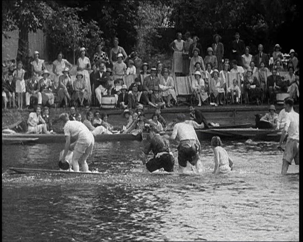 People in Sinking Rowing Boat, Watched by Crowd, 1933. Creator: British Pathe Ltd.