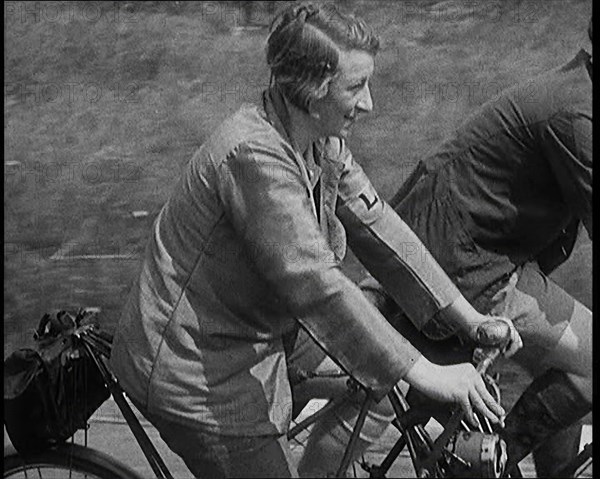 Large Group of Civilians Riding Bicycles Through Country Lanes, 1931. Creator: British Pathe Ltd.