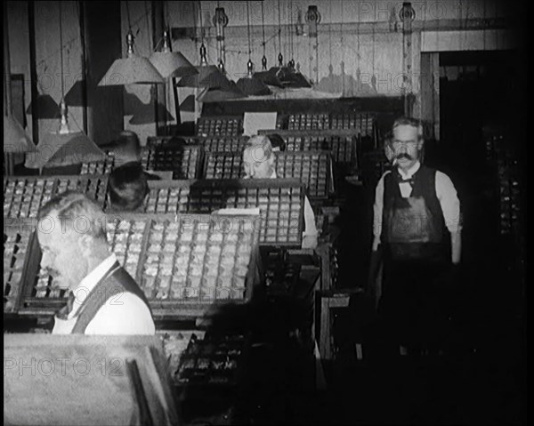 Journalists Working in the Compositing Room of a Newspaper Office, 1921. Creator: British Pathe Ltd.