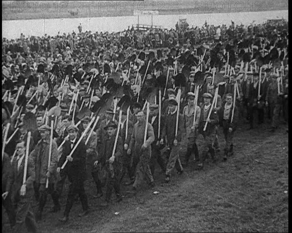 Parade of German Men with Spades and Shovels, 1933. Creator: British Pathe Ltd.