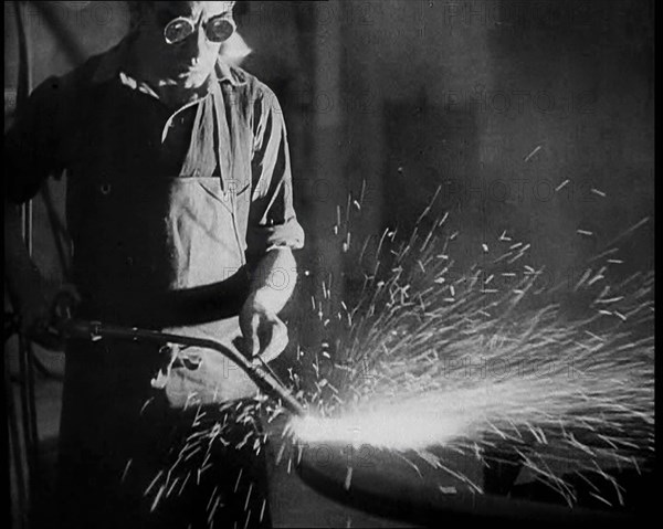 Man Working in a Factory, 1933. Creator: British Pathe Ltd.