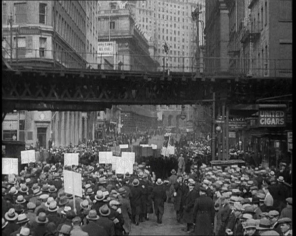 Crowd Walking Parading Down a Road and Holding Signs, 1933. Creator: British Pathe Ltd.