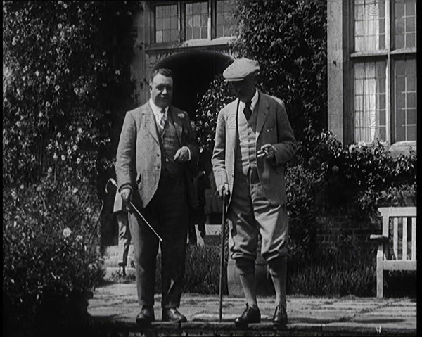 British Prime Minister Ramsay MacDonald Exits the Door of Chequers Holding a Stick..., 1924. Creator: British Pathe Ltd.