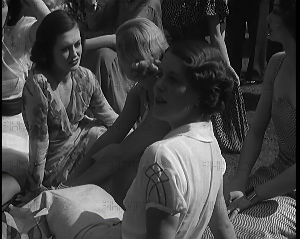 A Large Group of Female Civilians Posing for Photos, 1931. Creator: British Pathe Ltd.