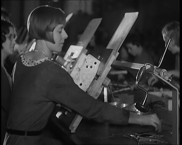 Female Civilians Working on a Factory Production Line, 1931. Creator: British Pathe Ltd.