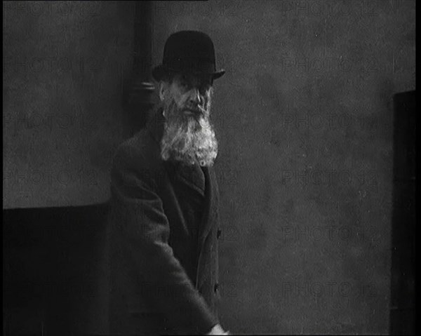 A Man Sporting a Beaver Beard Walking Along a Street, 1922. Creator: British Pathe Ltd.