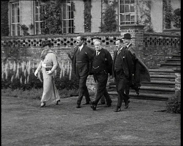 Stanley Baldwin, the British Prime Minister Walking from Himley Hall with Others, 1930s. Creator: British Pathe Ltd.