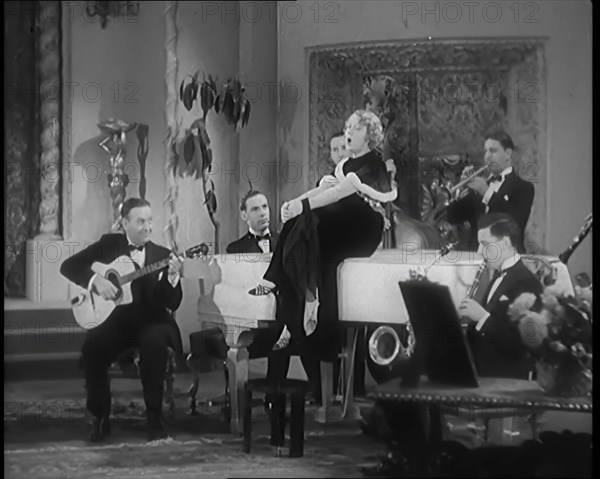 The Singer Elsie Carlisle and Her Band Performing a Song About Her Boyfriend Who Has Gone..., 1931. Creator: British Pathe Ltd.