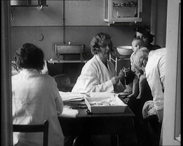 Female Civilians and Their Babies at Health Clinics Where the Babies Are Checked by Female..., 1931. Creator: British Pathe Ltd.