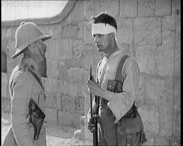 Scene from a Film: Male Actor Playing a Survivor from the Battle Being Questioned..., 1920s. Creator: British Pathe Ltd.