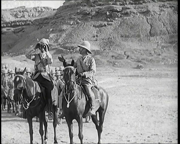 Scene from a Film: a Male Actor Playing a British Soldier on Horseback Looking Through..., 1920s. Creator: British Pathe Ltd.