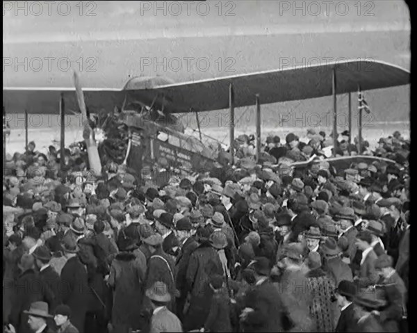 A Large Group of People Crowding Around Sir Alan Cobham's Aeroplane Greeting Him on His..., 1926. Creator: British Pathe Ltd.