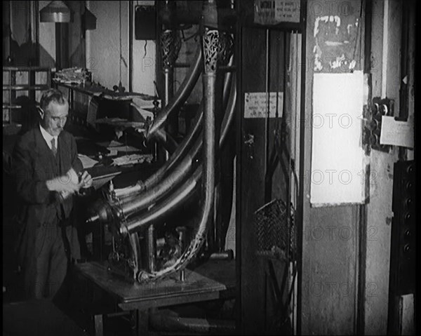 Worker in a Newspaper Office, 1921. Creator: British Pathe Ltd.