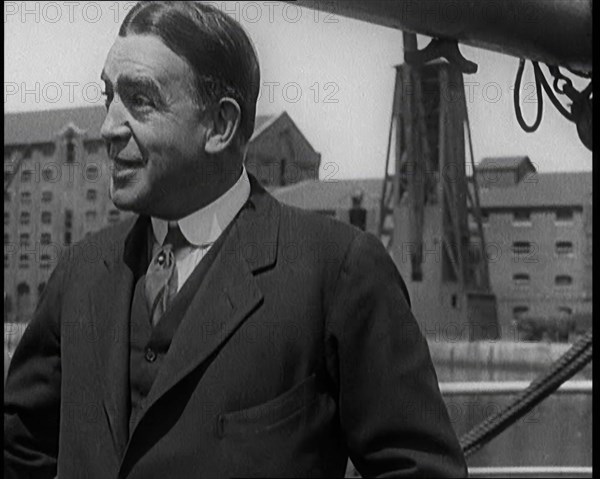 Sir Ernest Shackleton Standing on a Boat, 1921. Creator: British Pathe Ltd.