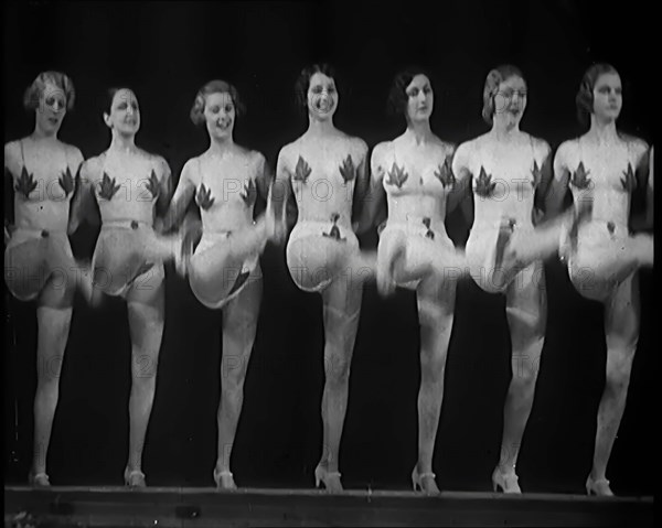 A Troupe of Dancers Wearing Fig Leaf Costumes Synchronised Dancing in Front of an Audience..., 1931. Creator: British Pathe Ltd.