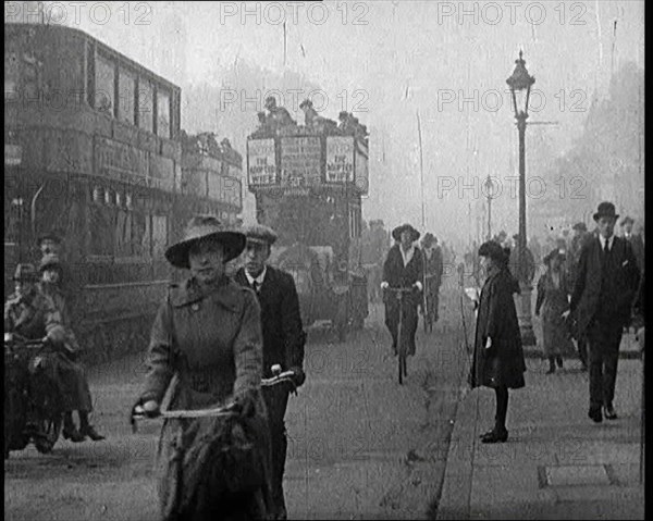 Traffic Scenes in London. Pedestrians, Cyclists, and Motorists All Passing By, 1922. Creator: British Pathe Ltd.