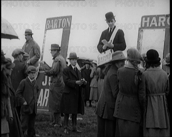 Book Makers 'Barton' and 'Arnold' Taking Bets at a Horse Race in Southern Ireland, United..., 1921. Creator: British Pathe Ltd.