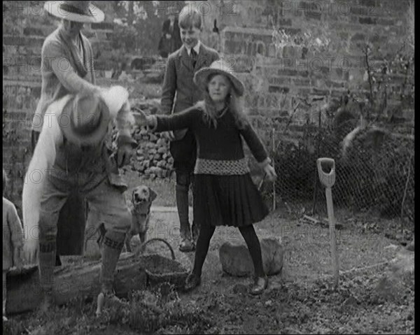 British Chancellor of the Exchequer Joseph Austen Chamberlain Working in the Garden With His...,1920 Creator: British Pathe Ltd.