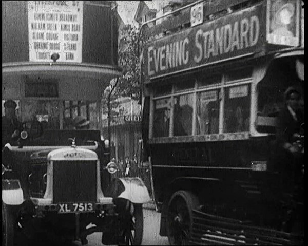 Buses Driving by in London, 1922. Creator: British Pathe Ltd.