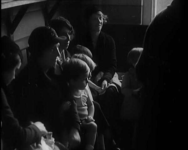 Female Civilians and Their Babies at Health Clinics Where the Babies Are Checked by Female..., 1931. Creator: British Pathe Ltd.