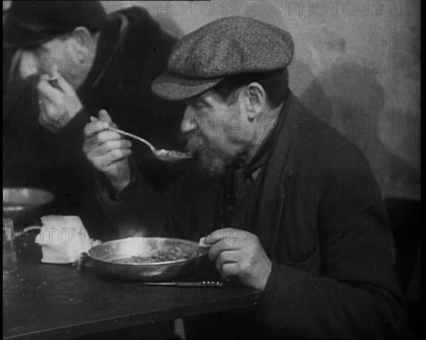 Two Men Eating Soup, 1933. Creator: British Pathe Ltd.