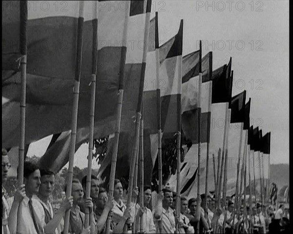 Hitler Youth Members Holding Flags, 1930s. Creator: British Pathe Ltd.