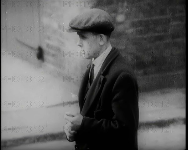 Male Civilians Standing in the Streets, 1926. Creator: British Pathe Ltd.