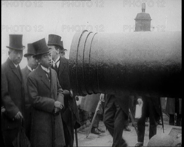 Japanese Prince Regent Hirohito Inspecting a Large Cannon With Japanese Dignitaries on the..., 1921. Creator: British Pathe Ltd.