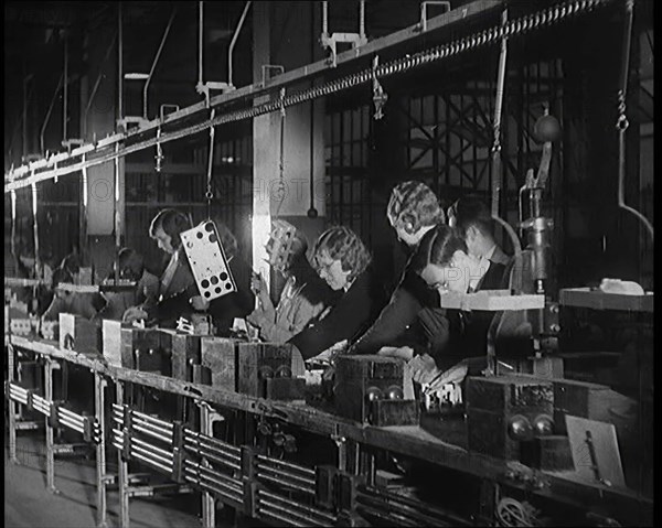 Female Civilians Working on a Factory Production Line, 1931. Creator: British Pathe Ltd.