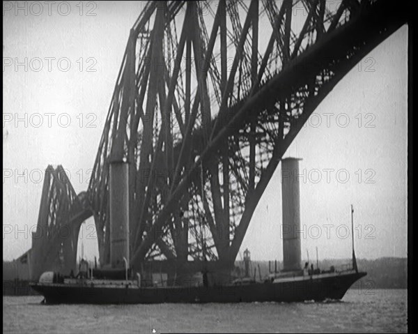 German Boat Passing Under the Forth Bridge in the United Kingdom, 1921. Creator: British Pathe Ltd.