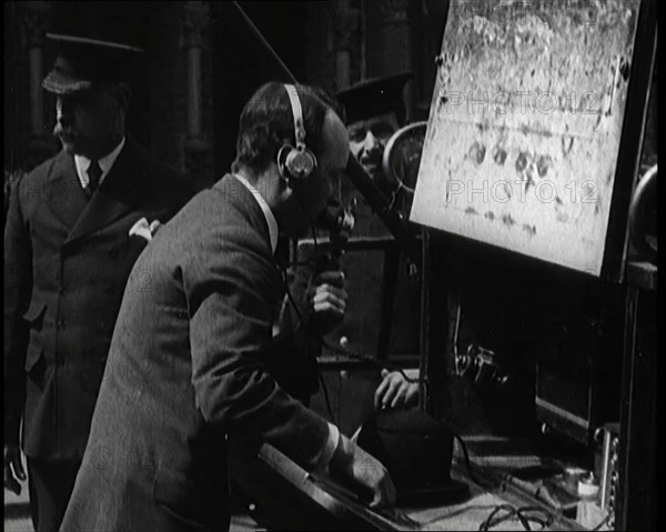 British Radio Operator Working at the Rear of a Fire Engine, 1920. Creator: British Pathe Ltd.