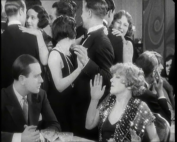 Scene from the Film 'Champagne': Betty Balfour in a Nightclub Drinking Champagne and..., 1920s. Creator: British Pathe Ltd.